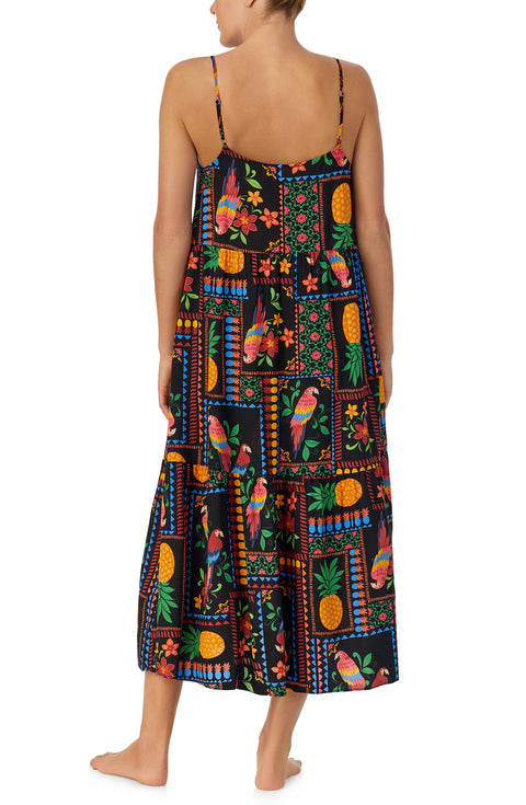 A lady wearing black short sleeve Sara Maxi Chemise with Tropical Fiesta print.