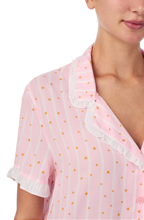 A lady wearing Chloe Pj Set In Starlit Stripes