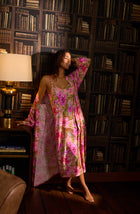 A lady wearing Madilyn Robe In Rosy Roar