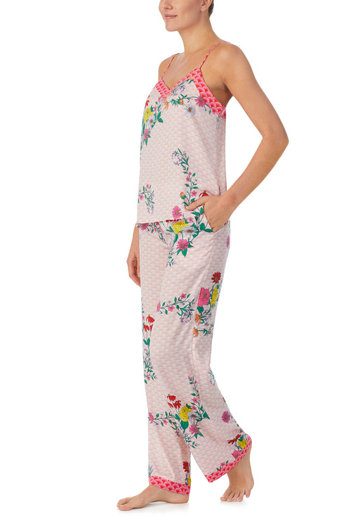A lady wearing pink sleeveless Lexi Pj Set with Wildflowers print.