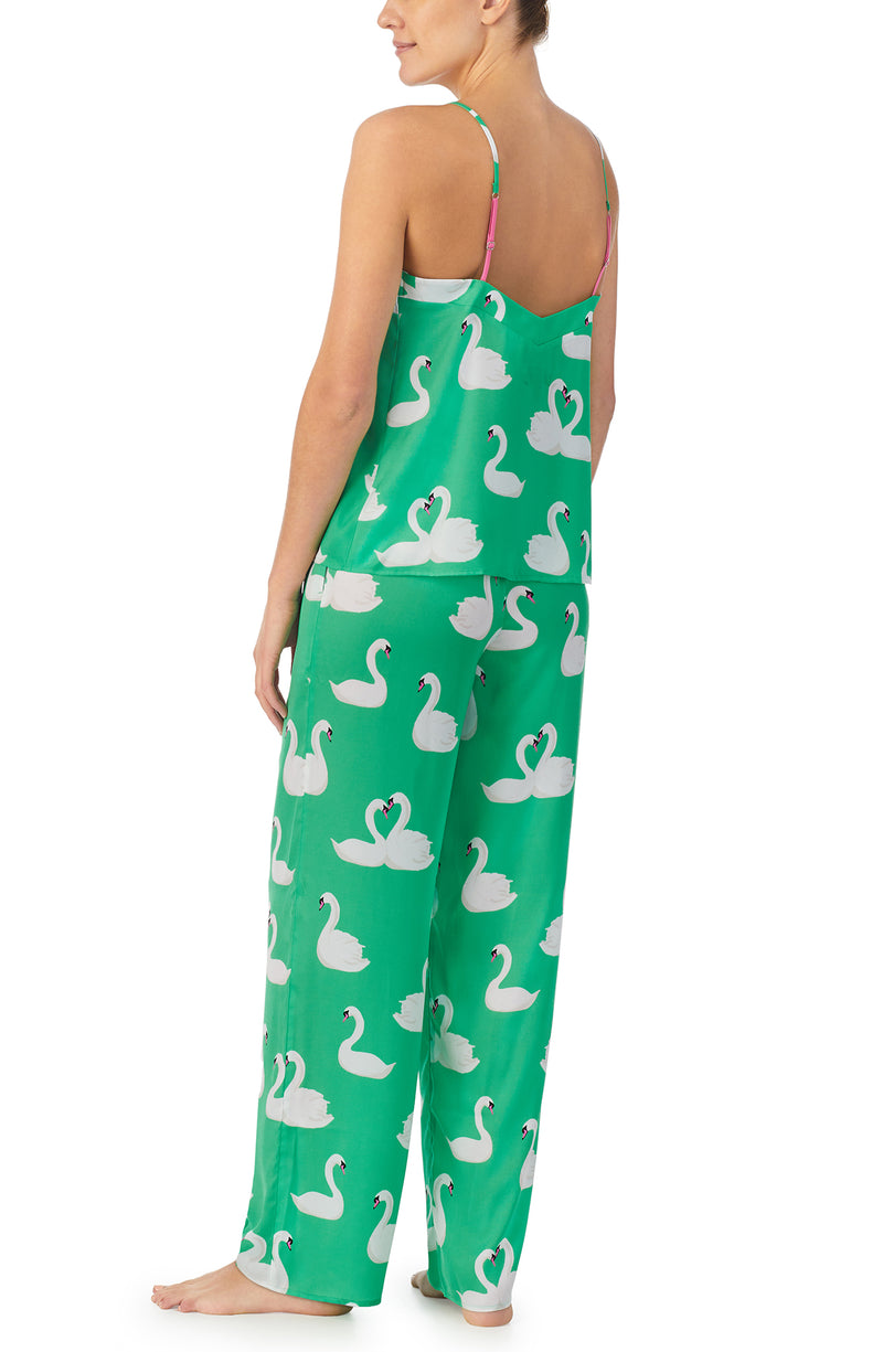 A lady wearing green sleeveless Lexi Pj Set with  Swan Soiree print.