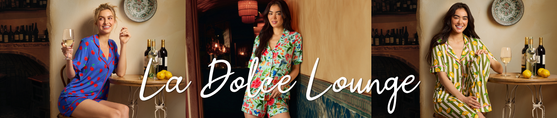 Three women modeling colorful printed loungewear sets in a cozy, stylish indoor setting with wine bottles and glasses