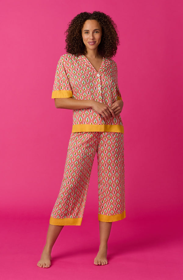 A lady wearing pink short sleeve Georgia Cropped Pj Set with Pineapple Pop print.