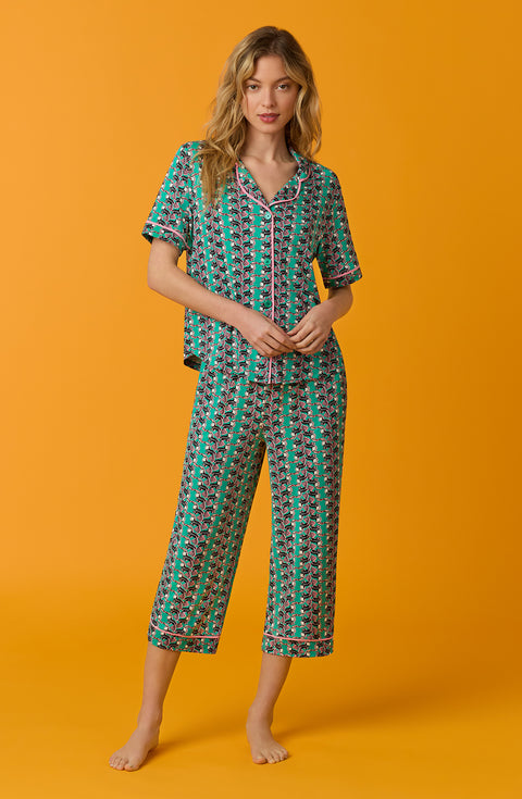 A lady wearing green short sleeve Soho Pj Set with Tucan Tango print.