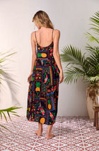 A lady wearing black short sleeve Sara Maxi Chemise with Tropical Fiesta print.