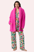 A Lady Wearing Blake Sherpa Short Jacket In Holly Jolly Pink