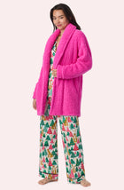 A Lady Wearing Blake Sherpa Short Jacket In Holly Jolly Pink standing in a front facing pose, looking directly toward the camera