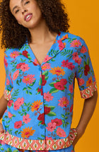 A lady wearing Blue short sleeve Georgia Short Pj Set with Island Floral print.