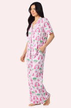 A Lady Wearing Sienna Long Knit Pj Set In Palm Springs Poodle Side Angle View