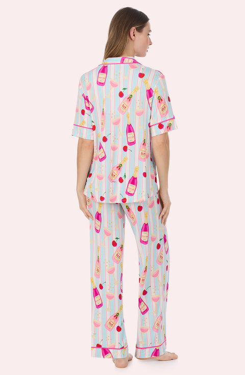 A Lady Wearing Dakota Long Knit Pj Set In Bottle Service in a back view pose