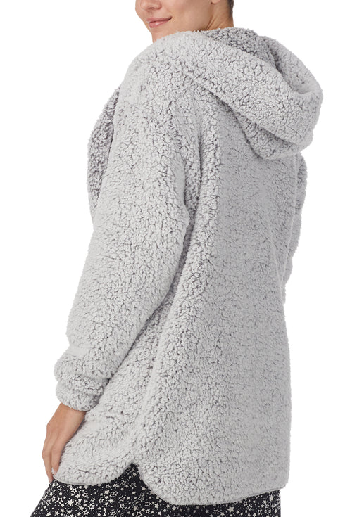 A lady wearing Grey Long Sleeve Aubrie Short Jacket with Frosted Slate print.