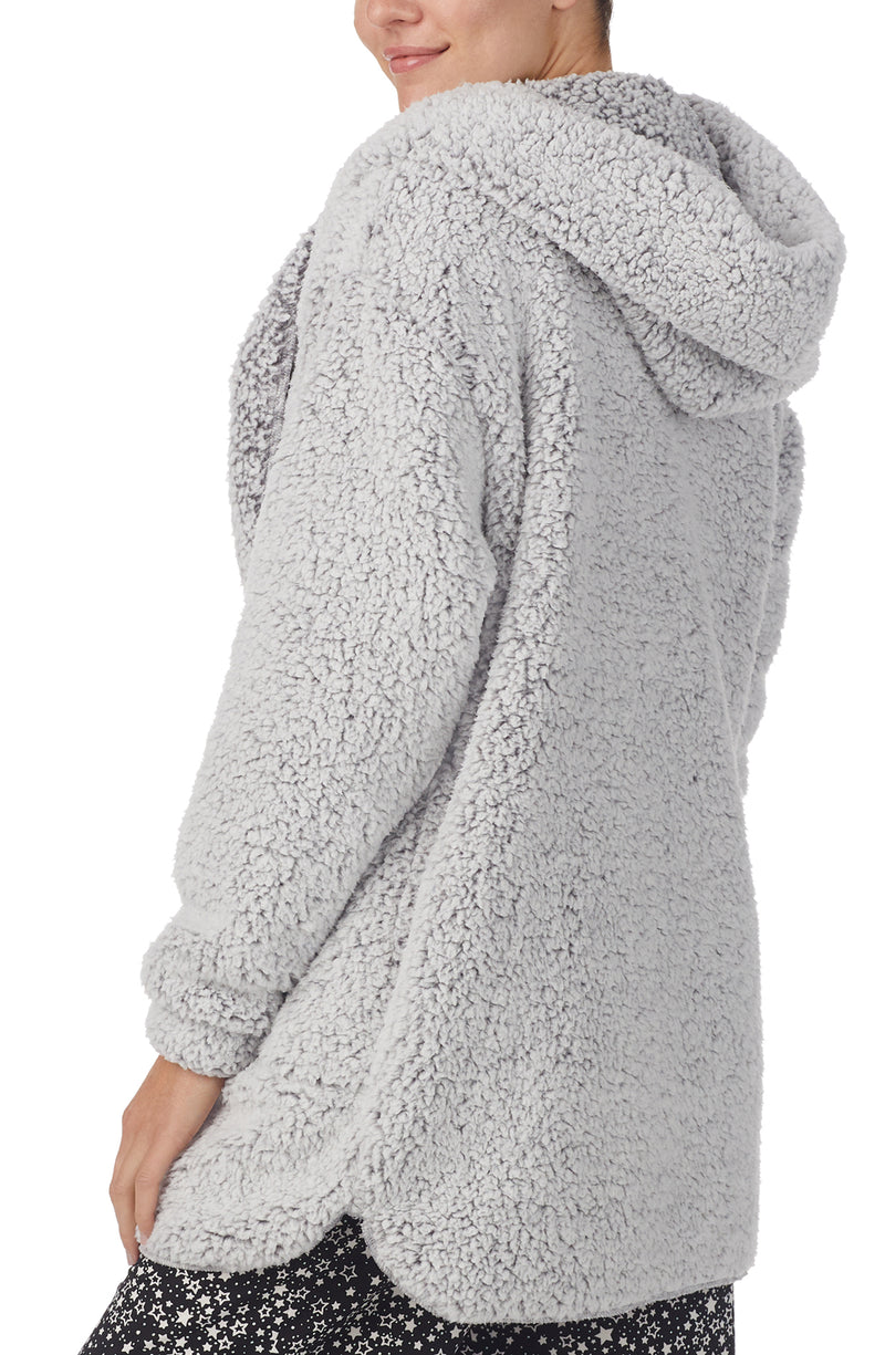 A lady wearing Grey Long Sleeve Aubrie Short Jacket with Frosted Slate print.