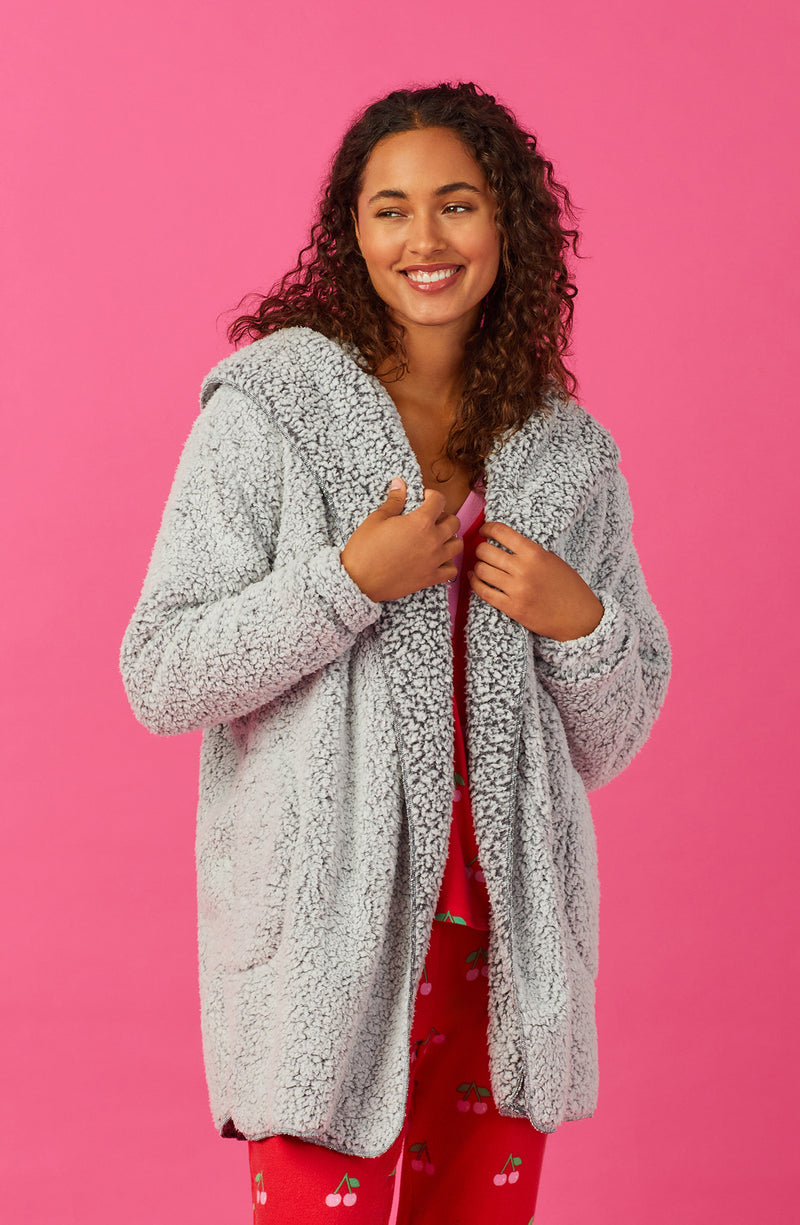 A lady wearing Grey Long Sleeve Aubrie Short Jacket with Frosted Slate print.
