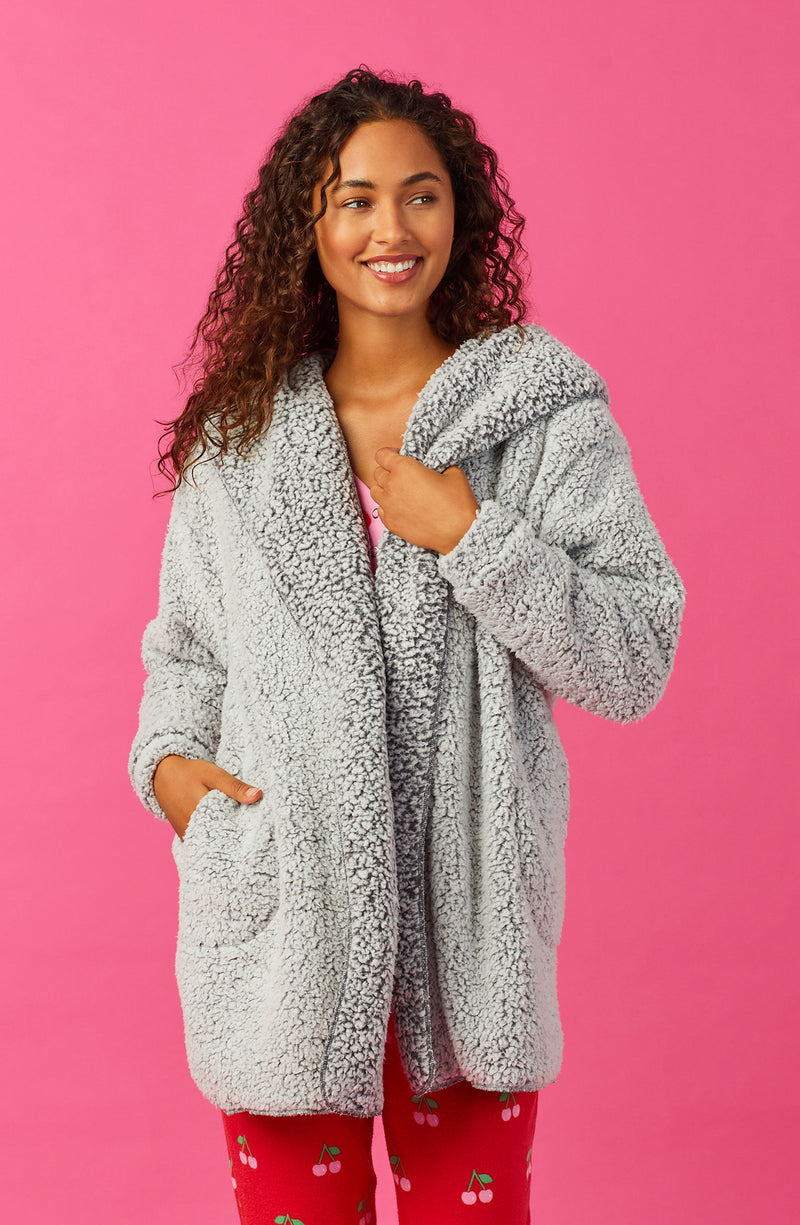 A lady wearing Grey Long Sleeve Aubrie Short Jacket with Frosted Slate print.