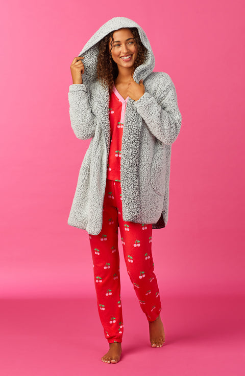 A lady wearing Grey Long Sleeve Aubrie Short Jacket with Frosted Slate print.