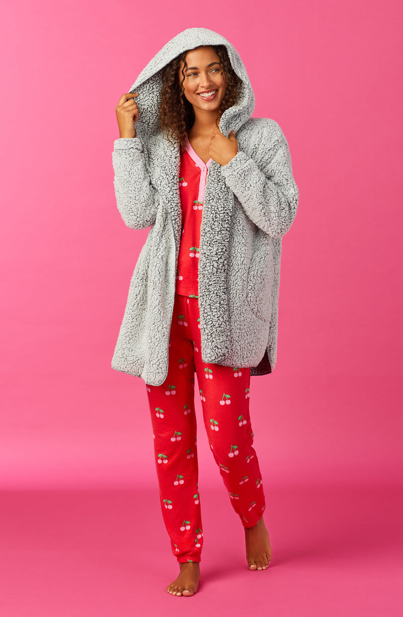 A lady wearing Grey Long Sleeve Aubrie Short Jacket with Frosted Slate print.