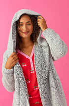 A lady wearing Grey Long Sleeve Aubrie Short Jacket with Frosted Slate print.