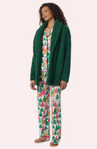 A Lady Wearing Blake Sherpa Short Jacket In Pine Green in a front view, side angle pose