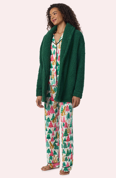 A Lady Wearing Blake Sherpa Short Jacket In Pine Green in a front view, side angle pose