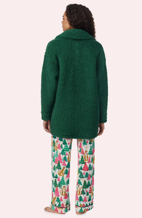 A Lady Wearing Blake Sherpa Short Jacket In Pine Green in a back view pose