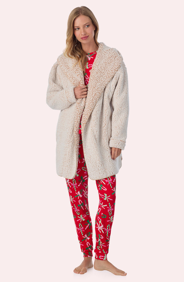 A lady wearing Aubrie Sherpa Short Jacket In Frosted Cappuccino