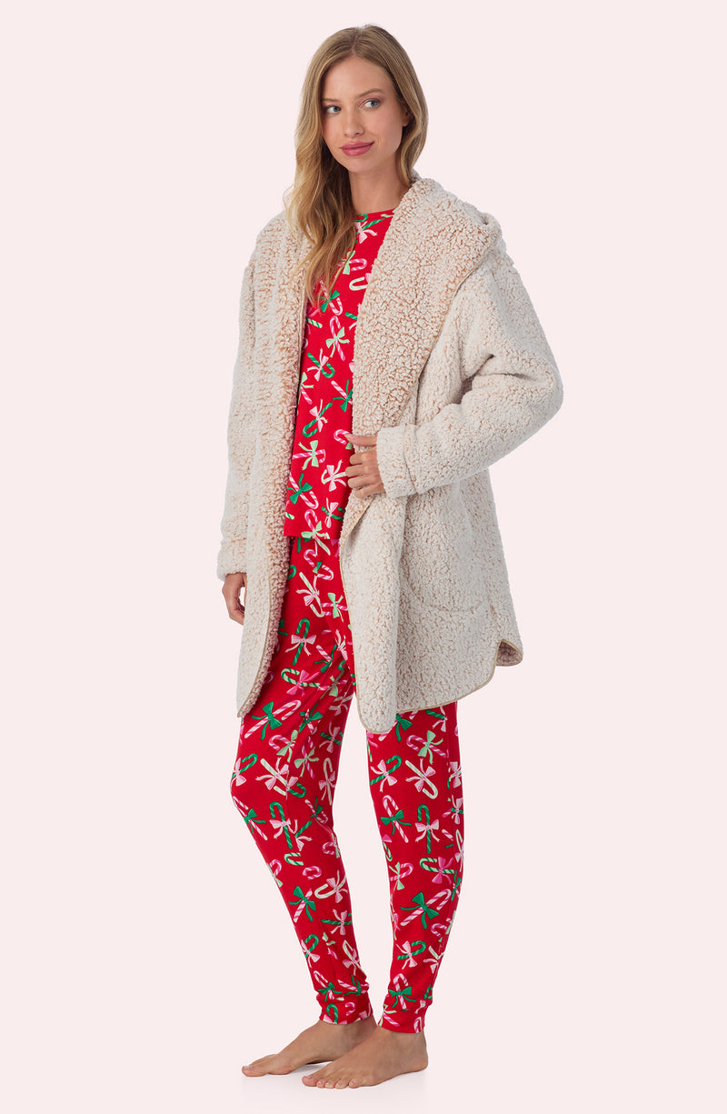 A lady wearing Aubrie Sherpa Short Jacket In Frosted Cappuccino