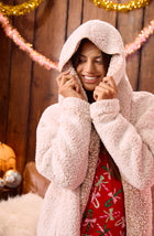 A lady wearing Aubrie Sherpa Short Jacket In Frosted Cappuccino