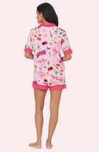 A Lady Wearing Dakota Short Knit Pj Set In Girl'S Trip in a back view standing pose