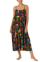 A lady wearing black short sleeve Sara Maxi Chemise with Tropical Fiesta print.