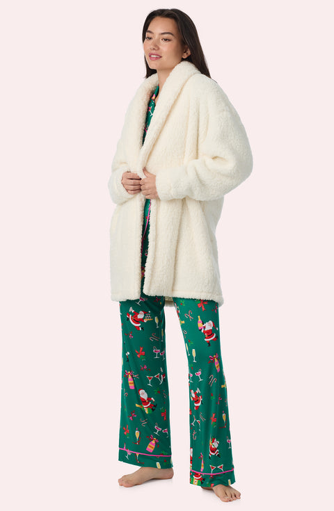 A Lady Wearing Blake Sherpa Short Jacket In Cream in a side angle pose