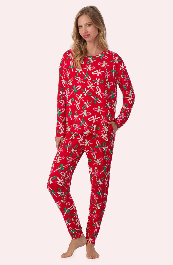 A lady wearing Lorena Long Knit Pj Set In Candy Cane Cutie