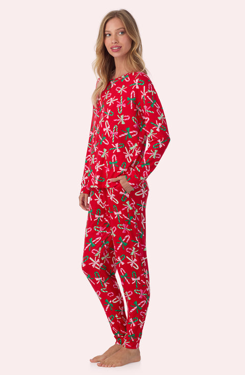 A lady wearing Lorena Long Knit Pj Set In Candy Cane Cutie