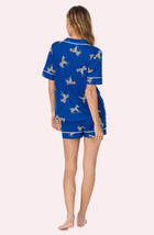 A lady wearing Sienna Short Knit Pj Set In Cobalt Zebra