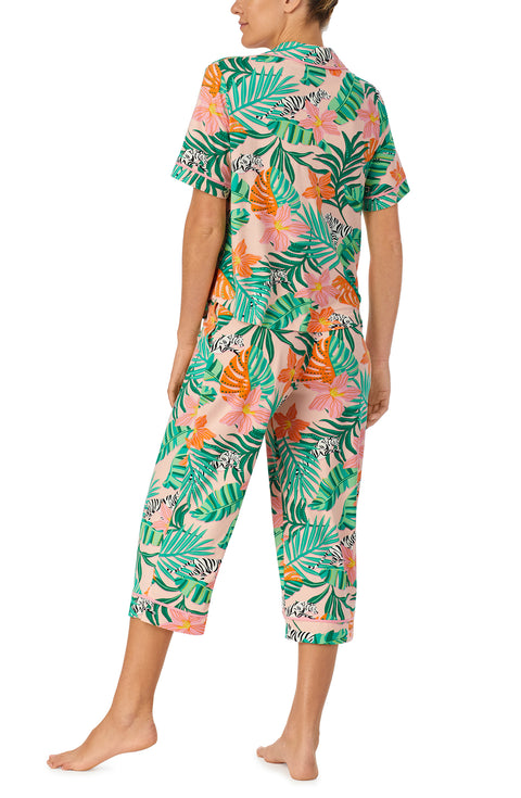 A lady wearing pink short sleeve Soho Pj Set withSunset Safari print.