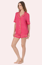 A Lady Wearing Dakota Short Knit Pj Set In Berry Stripe in a side angled pose