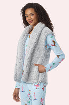 A Lady Wearing Tessa Sherpa Vest In Frosted Slate in a closer look, side angle pose