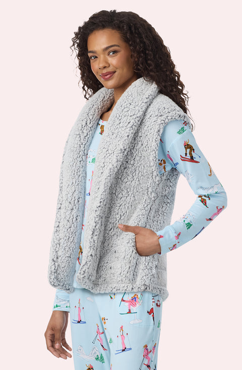A Lady Wearing Tessa Sherpa Vest In Frosted Slate in a closer look, side angle pose