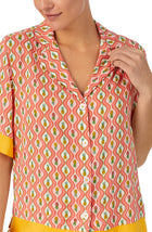 A lady wearing pink short sleeve Georgia Short Pj Set with Pineapple Pop print.