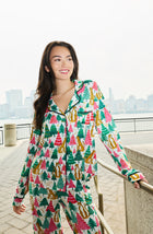 A Lady Wearing Collette Knit Pj Set In Jolly Jungle standing outdoors in a front view look