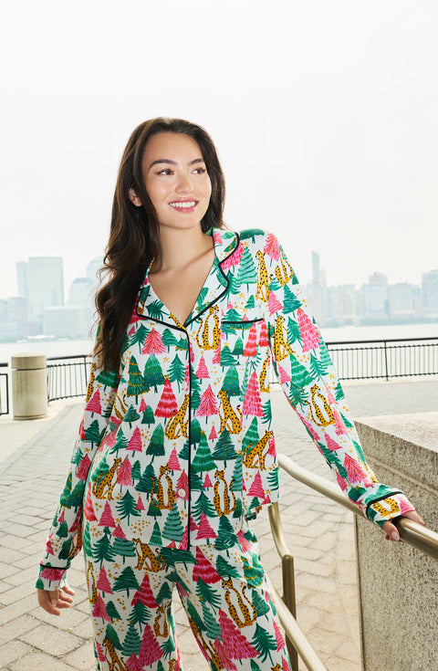 A Lady Wearing Collette Knit Pj Set In Jolly Jungle standing outdoors in a front view look