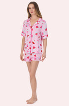 A Lady Wearing Dakota Short Knit Pj Set In Cherry On Top in a front view side angled pose