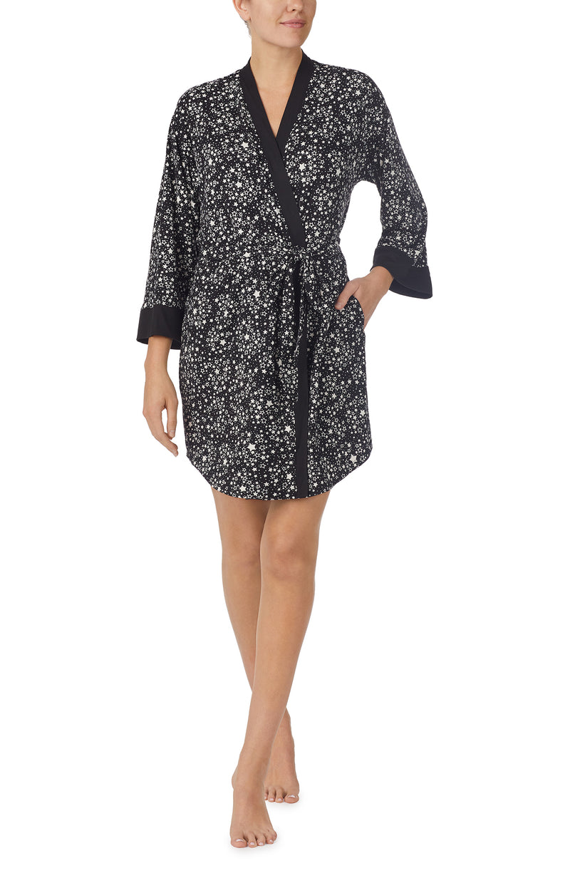 A lady wearing black quarter sleeve Nadia Robe with Midnight Sky print.