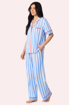 A Lady Wearing Sienna Long Knit Pj Set In True Blue Stripe Side Angle View