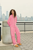 A Lady Wearing Collette Knit Pj Set In Sugar Stripe while standing outdoors