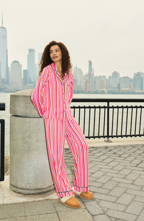 A Lady Wearing Collette Knit Pj Set In Sugar Stripe while standing outdoors