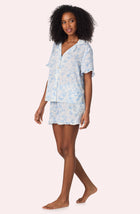 A lady wearing Nia Short Woven Pj Set In Butterflies & Bows