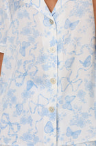 A lady wearing Nia Short Woven Pj Set In Butterflies & Bows