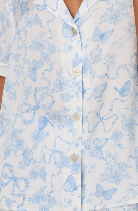 A lady wearing Nia Short Woven Pj Set In Butterflies & Bows