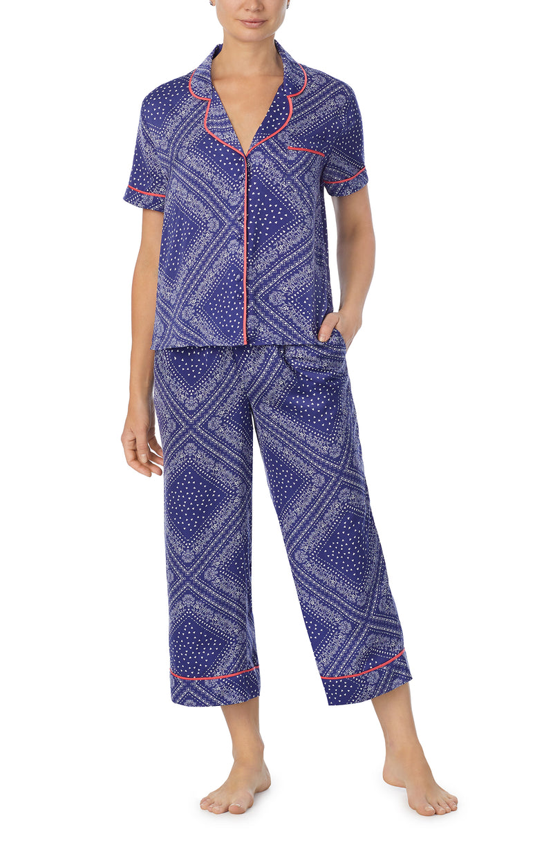 A lady wearing blue short sleeve chelsea pj set with bandana babe print.