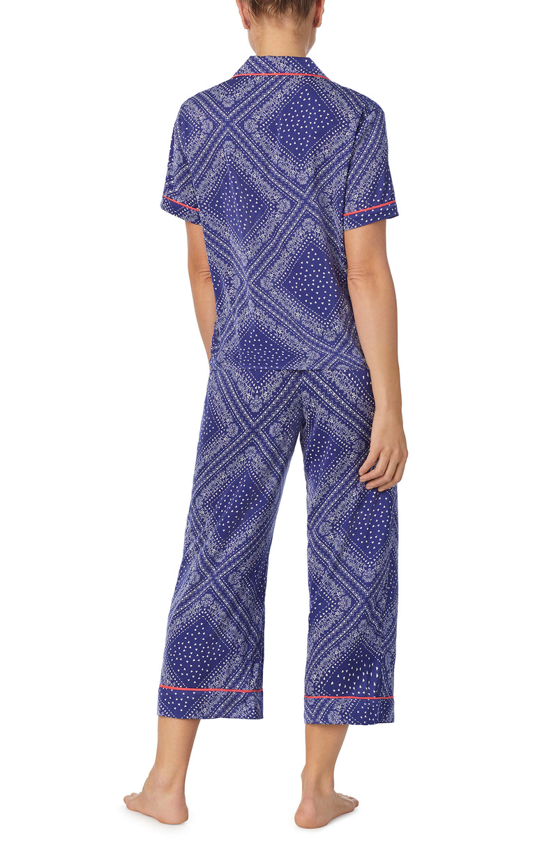 A lady wearing blue short sleeve chelsea pj set with bandana babe print.